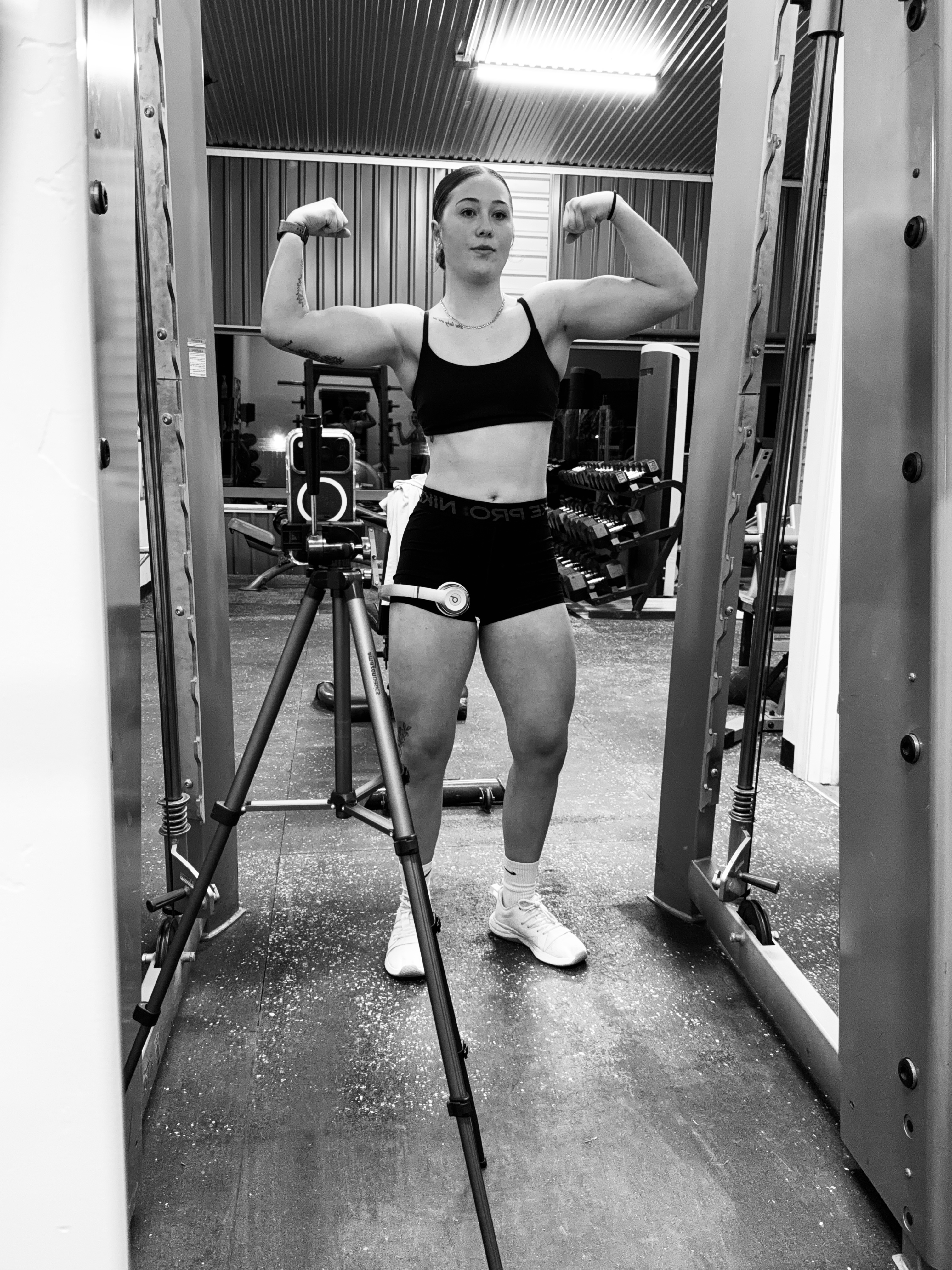 Rylee working inside a power rack at the gym
